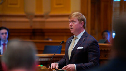 Blake Tillery stands in the well of the floor of the Georgia state Senate