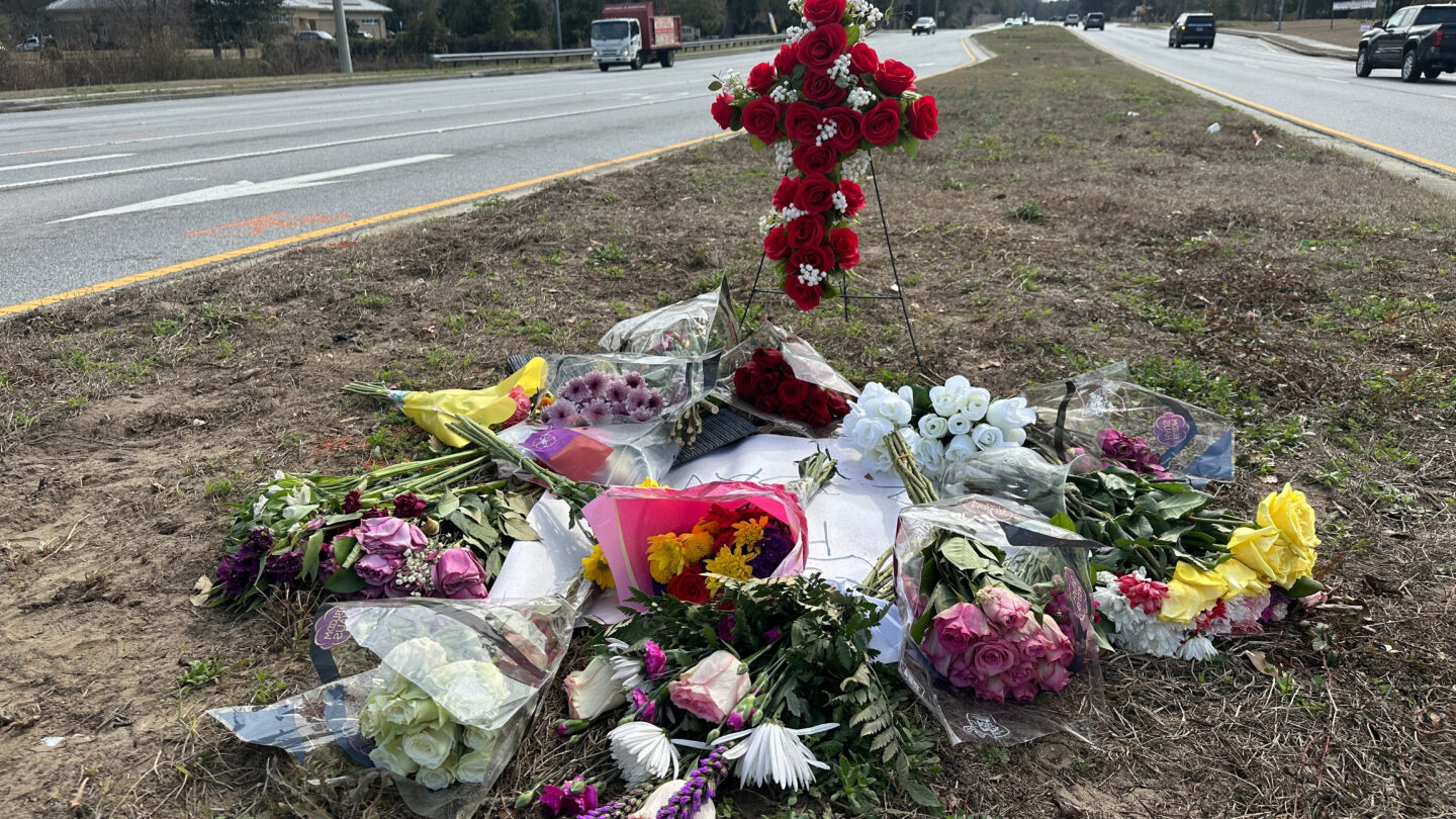 A pile of flower bouquets left on the side of the road