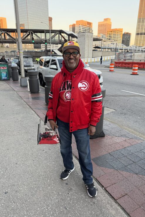 A man dressed in Hawks gear.