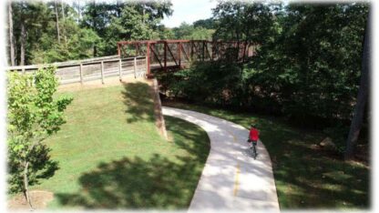 A trail with a bridge over it