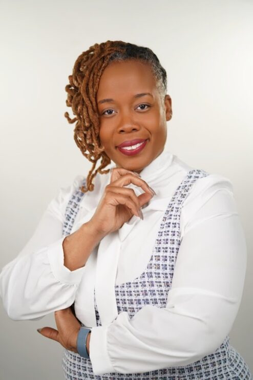A woman posing for a headshot.