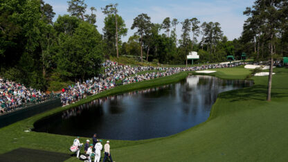 A large pond in the middle of a gold course