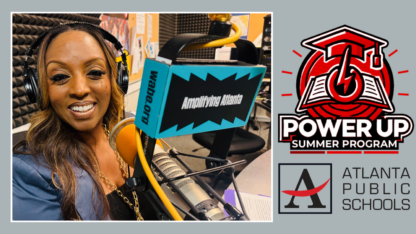 Shelly Goodrum sits in the WABE studio next to a microphone on the left. The red Power Up logo on the right with the Atlanta Public Schools logo