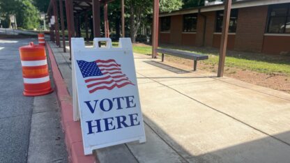 A vote here sign sits outside an elementary school in cobb county georgia on primary election day
