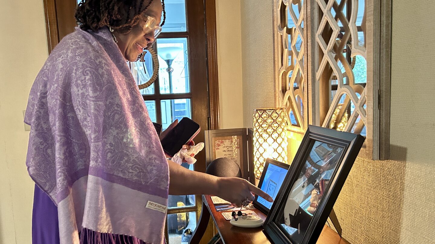 Veteran Arthurine Williams-Wright at home looking through photos of her time in the United States Army Corps of Engineers.