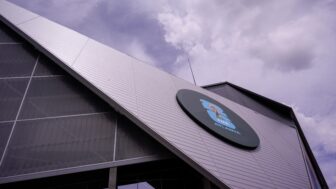 The triangular side of a silver stadium with a circle on it containing FIFA World Cup branding