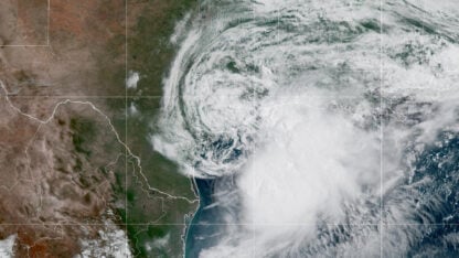 A satellite image shows a tropical storm along the Gulf Coast