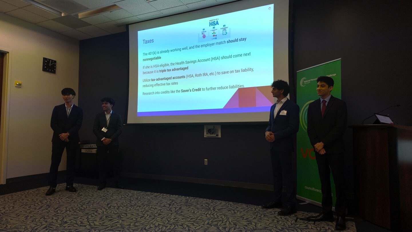A group of 4 high schoolers are presenting a financial plan to judges.