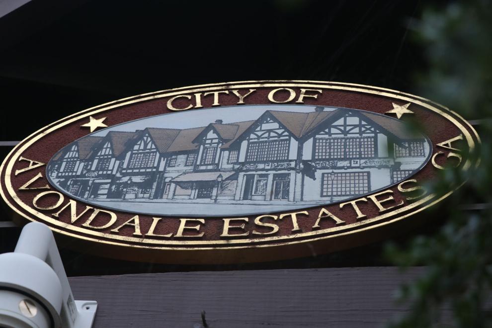 An oval sign that says City of Avondale Estates