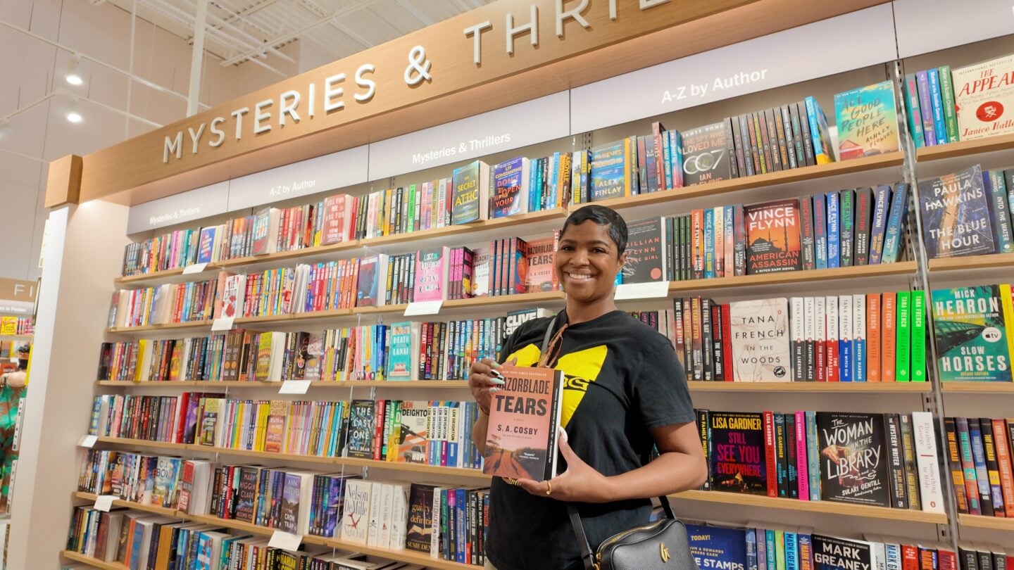A woman holding a book.